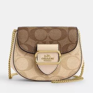 Signature coated canvas and smooth leather
Inside multifunction pocket